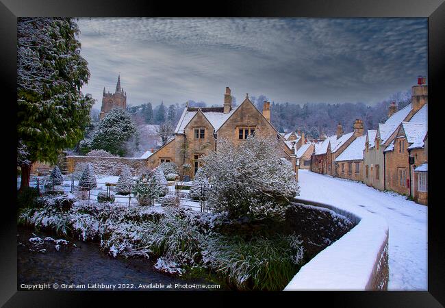 Castle Combe in the snow Framed Print by Graham Lathbury