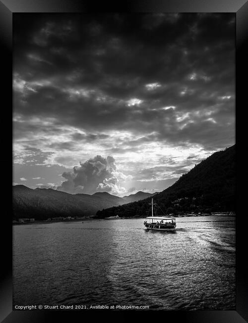 Boat and mountains at sunset - black and white Framed Print by Stuart Chard