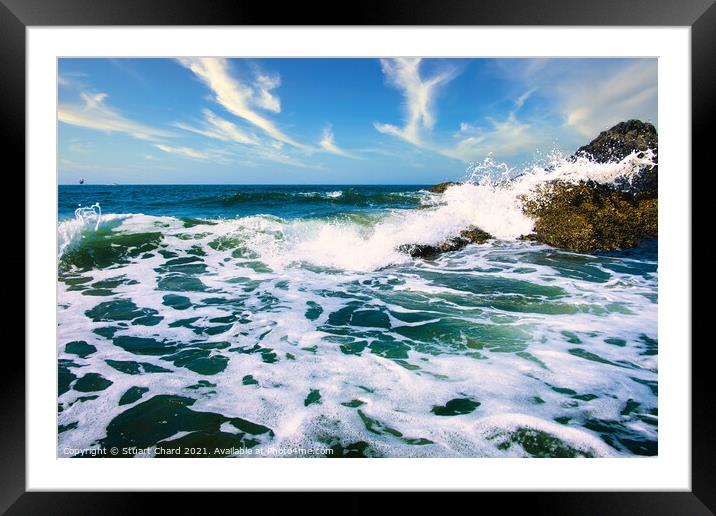 Waves crashing over the rocks with surf and spray Framed Mounted Print by Stuart Chard