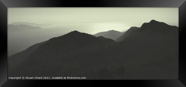 Sunset Over The Mountains Silhouette Of A Mountain Range Against The Sky Panorama Framed Print by Stuart Chard