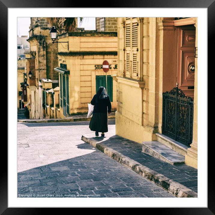 Nun standing by the door at the St. Theresa School Framed Mounted Print by Stuart Chard