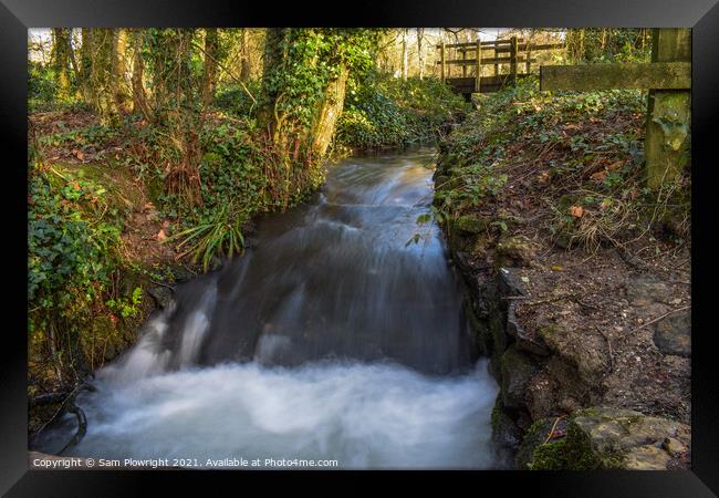 Waterfall flowing under a bridge at Tehidy woods Framed Print by Sam Plowright