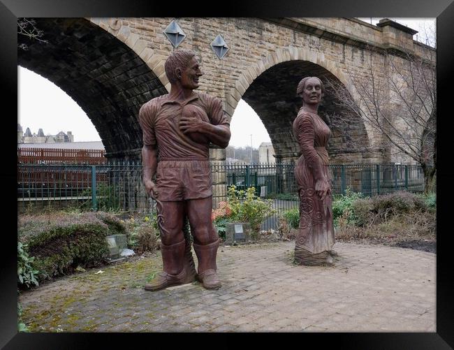 Sculptures of man and woman in Dewsbury Framed Print by Roy Hinchliffe