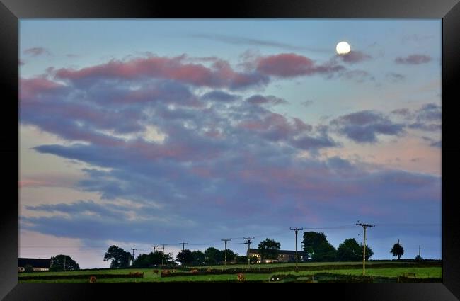 Sunset with moon in Holmfirth Framed Print by Roy Hinchliffe