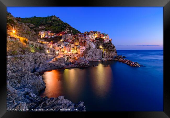 Sunset and night view of Manarola, one of the five Mediterranean villages in Cinque Terre, Italy, famous for its colorful houses and harbor Framed Print by Chun Ju Wu
