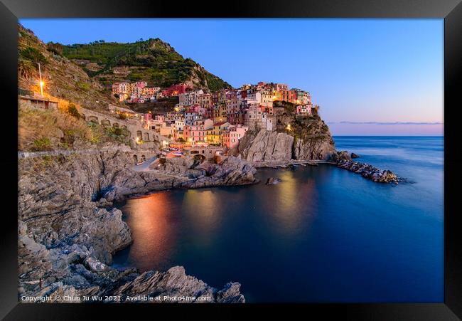 Sunset and night view of Manarola, one of the five Mediterranean villages in Cinque Terre, Italy, famous for its colorful houses and harbor Framed Print by Chun Ju Wu