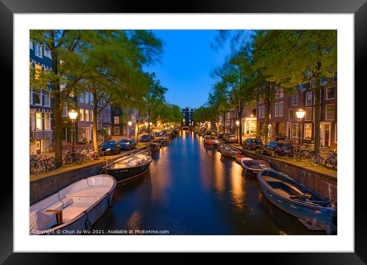 Night view of buildings and boats along the canal in Amsterdam, Netherlands Framed Mounted Print by Chun Ju Wu