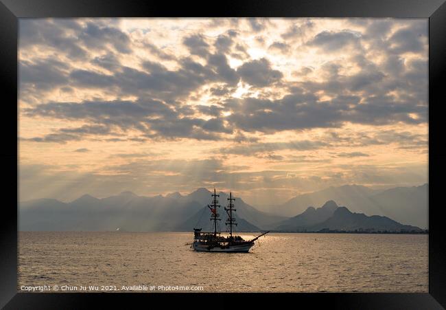 A ship sailing on the sea under the sunset heaven light Framed Print by Chun Ju Wu