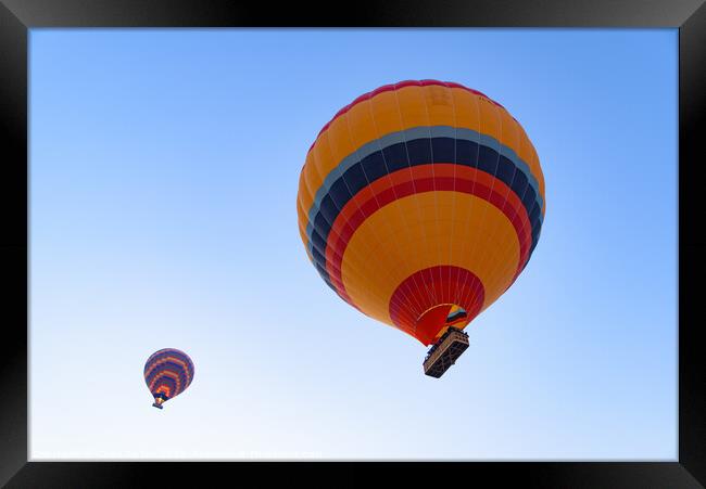 Flying hot air balloons in the sky in Goreme, Cappadocia, Turkey Framed Print by Chun Ju Wu