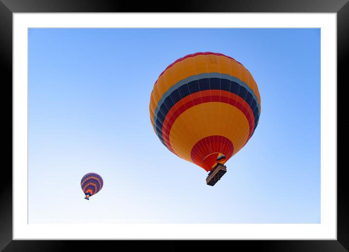 Flying hot air balloons in the sky in Goreme, Cappadocia, Turkey Framed Mounted Print by Chun Ju Wu