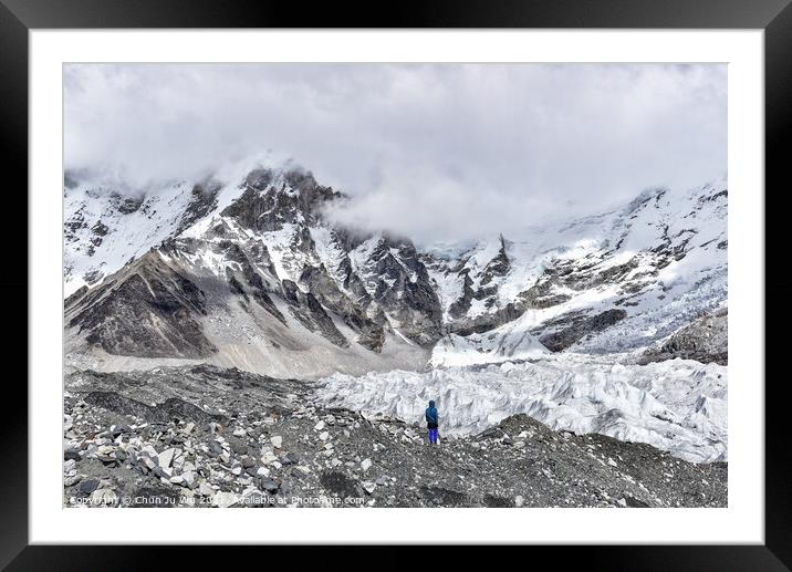 A man standing in front of the glacier at Himalayas mountain range in Nepal Framed Mounted Print by Chun Ju Wu