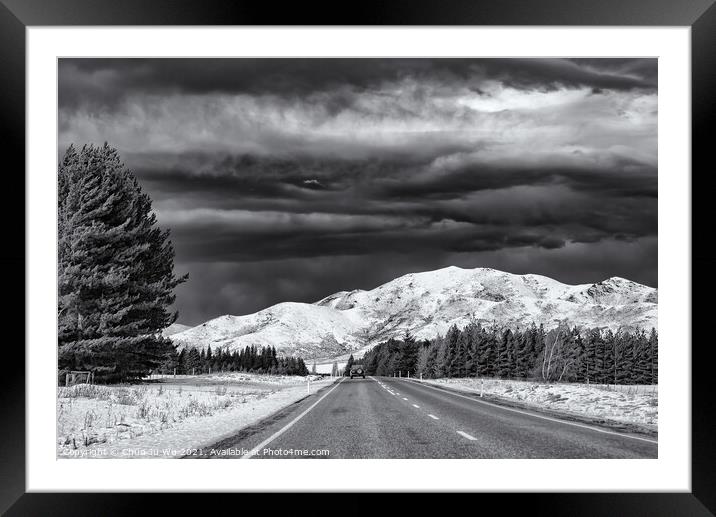 Road trip in winter with snow mountains at backgro Framed Mounted Print by Chun Ju Wu