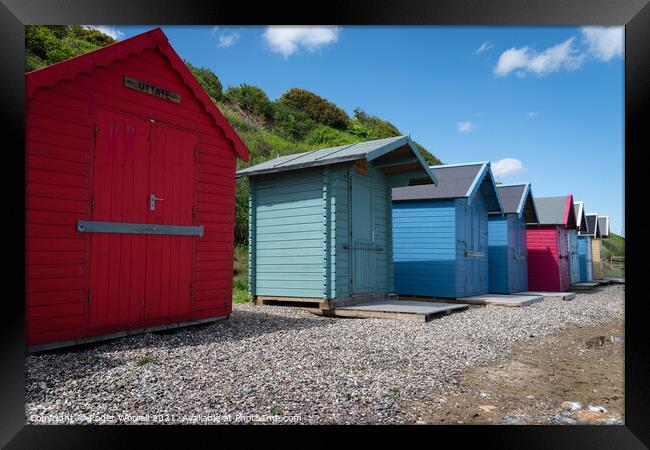 Colourful Norfolk Beach Huts Framed Print by Roger Worrall