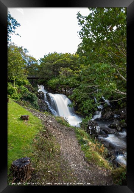 A close up of a hillside next to a waterfall Framed Print by Roger Worrall