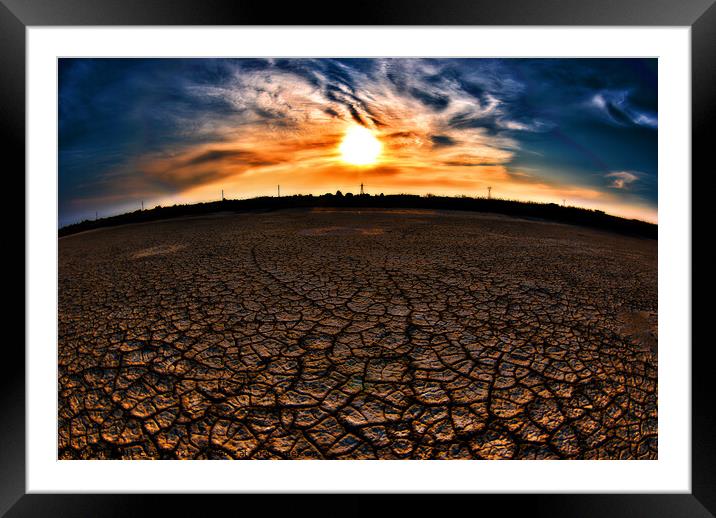 Cracked earth in dry lake Framed Mounted Print by Nic Croad