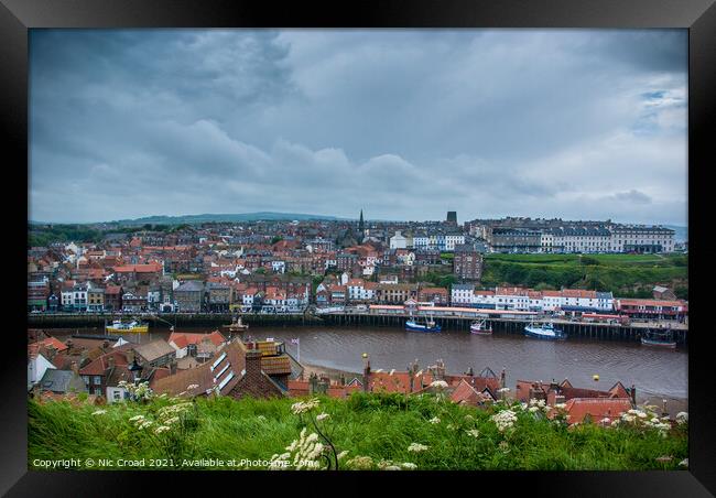 Whitby town and harbour Framed Print by Nic Croad