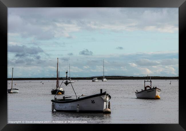 Boats anchored in Orford Harbour Framed Print by David Swayne