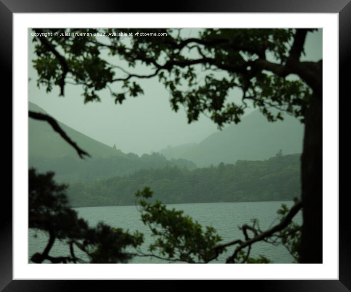 Peering through the trees at Derwent Water and mountains Framed Mounted Print by Jules D Truman