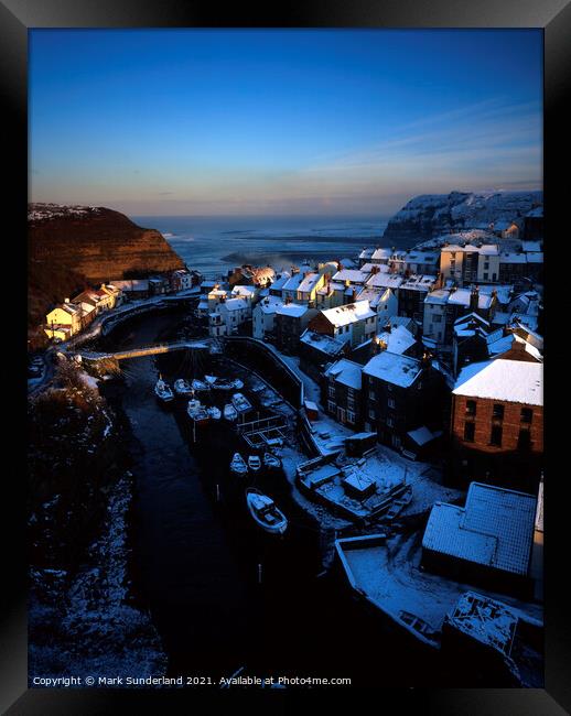 Snow Covered Rooftops at Staithes Framed Print by Mark Sunderland