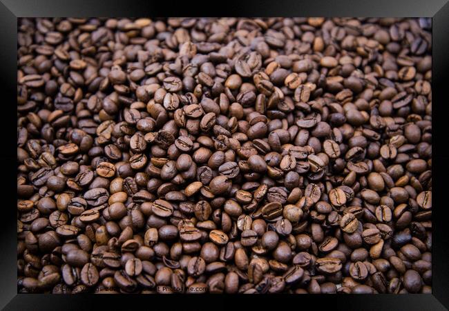 top view of fresh roasted coffee beans background. Background of roasted coffee beans	 Framed Print by Emils Vanags