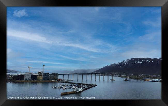 Gleaming Tromso Bridge Reflecting Clouds over the Sea Framed Print by Anish Punchayil Sukumaran