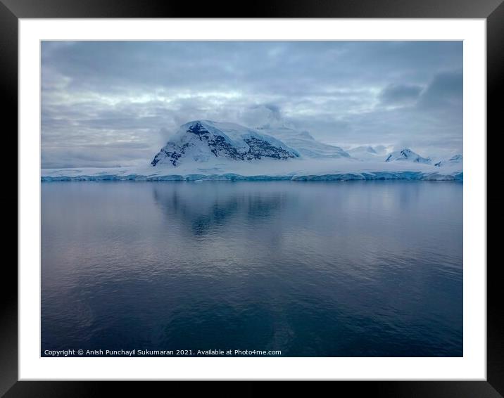 snow covered mountains in Antarctica and blue clam Framed Mounted Print by Anish Punchayil Sukumaran
