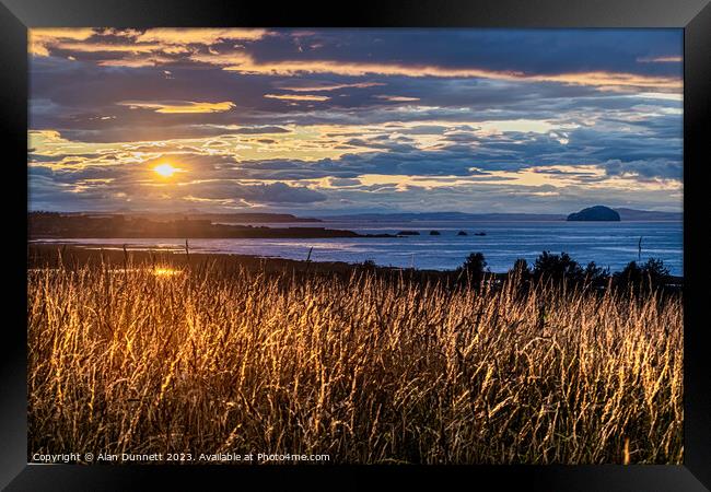 Golden Hour Over Verdant Pasture over Dunbar Framed Print by Alan Dunnett