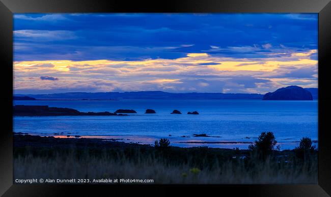 Sunset at Bass Rock. Heavenly Assemblage Over the  Framed Print by Alan Dunnett