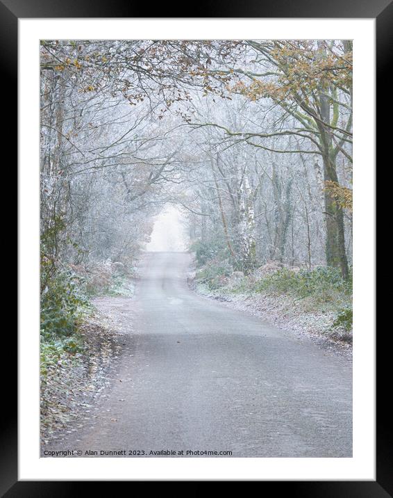 Frosty woodland road Framed Mounted Print by Alan Dunnett