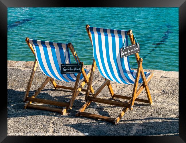 A pair of blue striped deckchairs with reserved signs, St. Ives harbour, Cornwall Framed Print by Photimageon UK