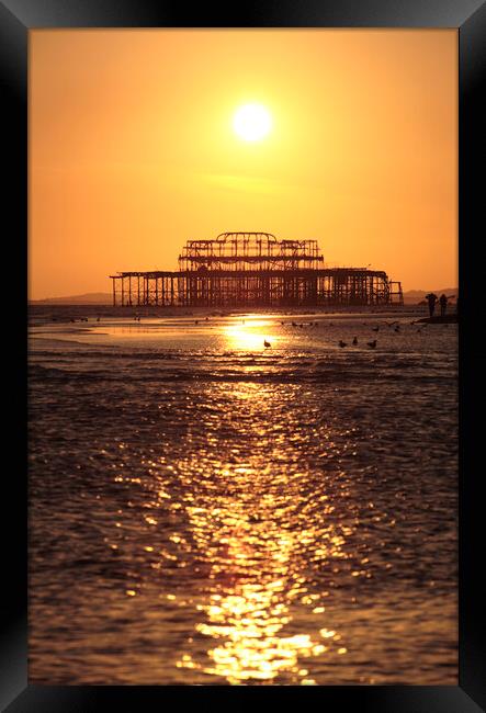 Brighton West Pier at Sunset Framed Print by Neil Overy