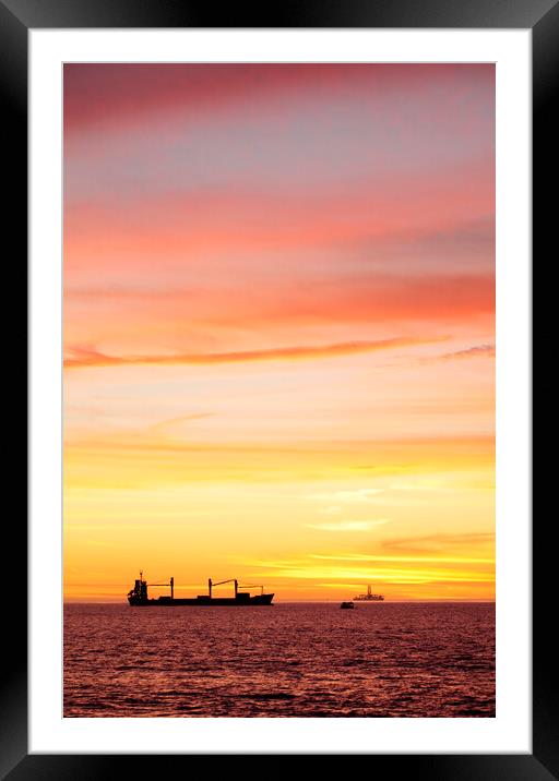 Sunset over ships waiting to enter Cape Town Harbour Framed Mounted Print by Neil Overy
