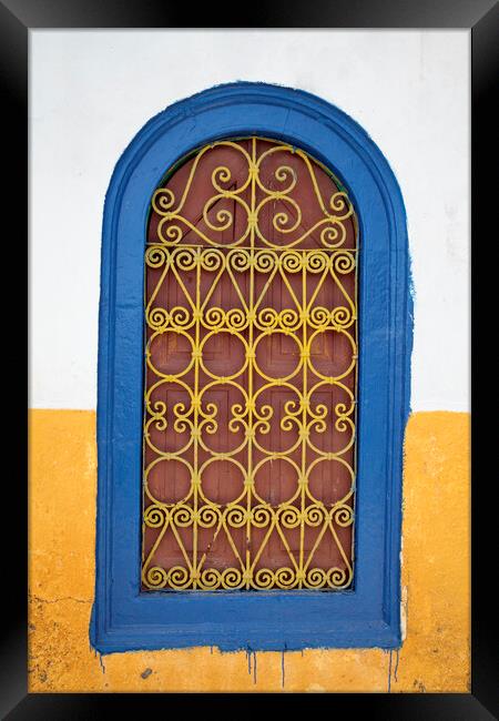 Colorful old wooden window shutter, Kastellorizo, Greece Framed Print by Neil Overy