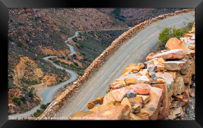 Ascending the serpentine Swartberg Pass. Framed Print by Adrian Turnbull-Kemp