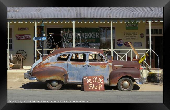 Rusting relic outside antiques shop Framed Print by Adrian Turnbull-Kemp