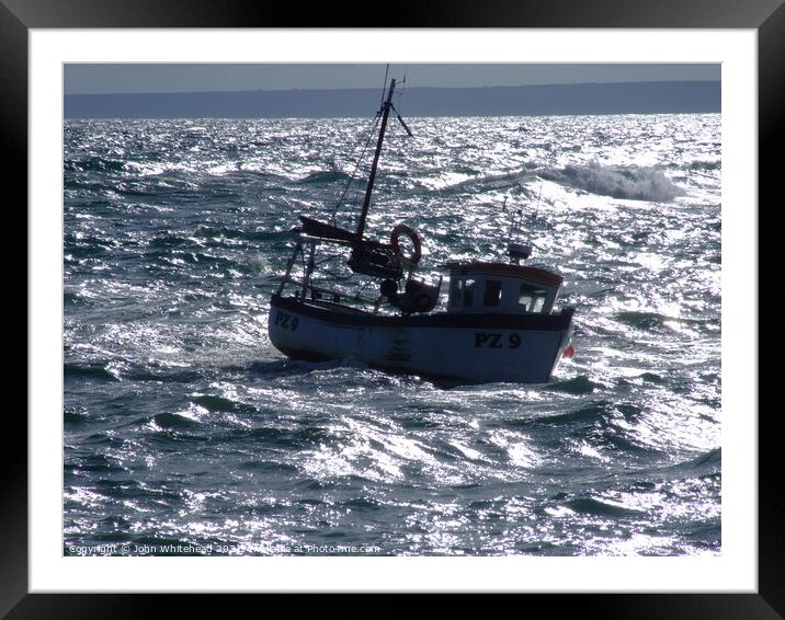 Fishing Boat bobbing in the sea Framed Mounted Print by John Whitehead
