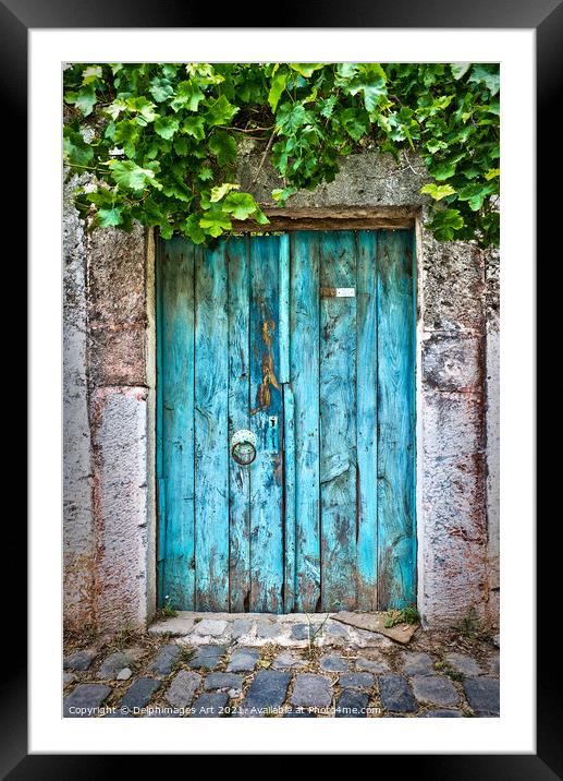 Old blue door in a village in Turkey Framed Mounted Print by Delphimages Art