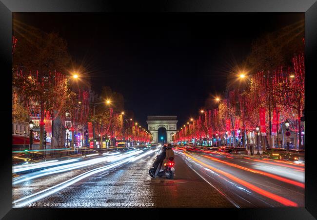 Christmas lights at night in Paris Champs Elysees Framed Print by Delphimages Art
