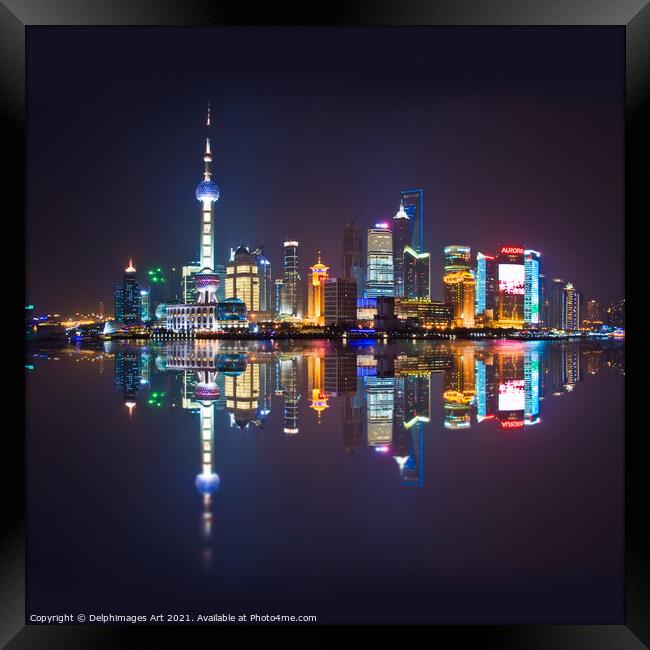 Shanghai skyline at night reflections in the river Framed Print by Delphimages Art