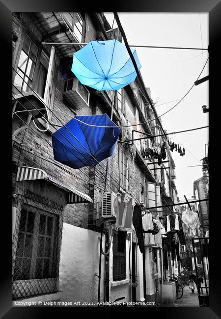 Shanghai, China. Umbrellas in a street after the r Framed Print by Delphimages Art