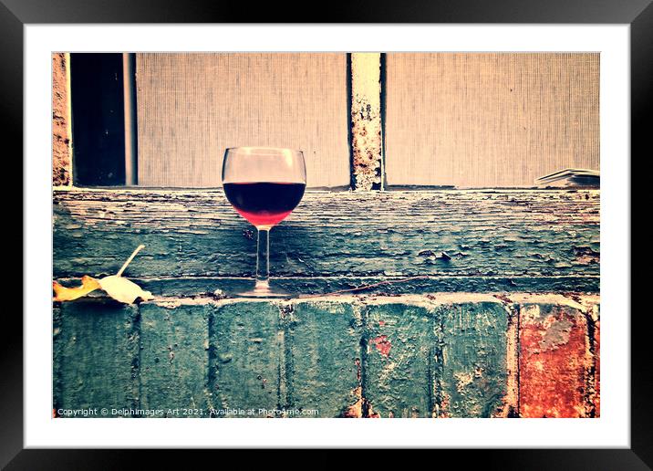 Glass of french red wine on a window in Paris Framed Mounted Print by Delphimages Art