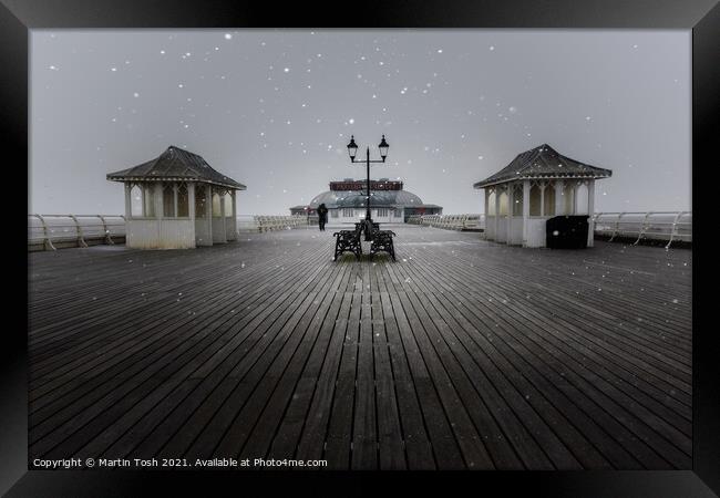 Flurry. Snowfall on Cromer Pier, Norfolk  Framed Print by Martin Tosh