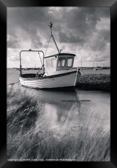 Fishing boat in salt marsh Framed Print by Martin Tosh
