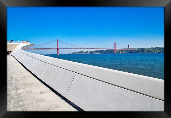 Landmark suspension 25 of April bridge over Tagus River in Lisbon Framed Print by Elijah Lovkoff