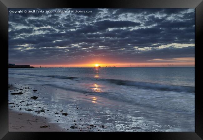 Sunrise with moody clouds Framed Print by Geoff Taylor