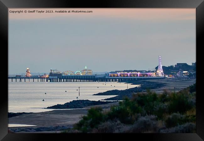 Clacton pier of an evening Framed Print by Geoff Taylor