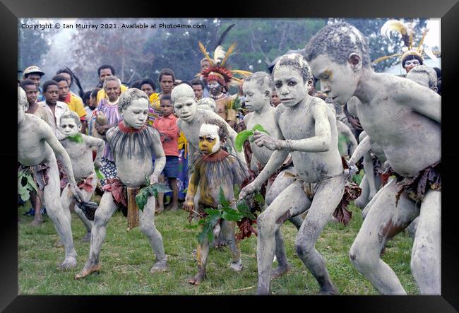 Children dancing as Asaro mudmen, Papua New Guinea Framed Print by Ian Murray