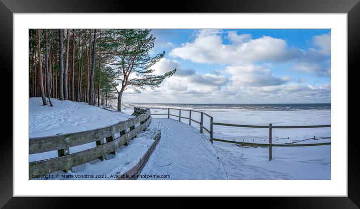 Winter snow covered Baltic sea coast Framed Mounted Print by Maria Vonotna