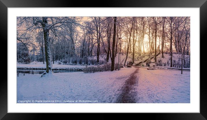 Sunset over snowy winter park Framed Mounted Print by Maria Vonotna