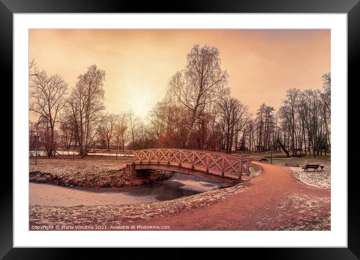 Sunset over wooden bridge in city park Framed Mounted Print by Maria Vonotna